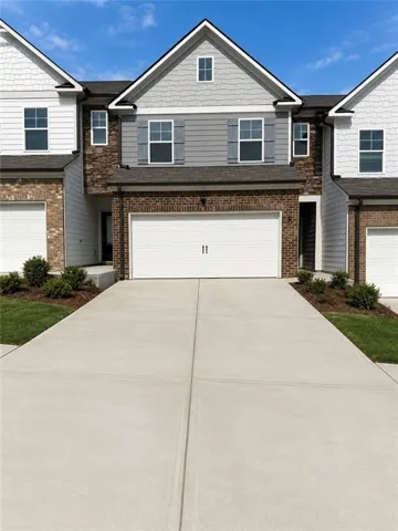 Brick and siding exterior featuring white trim and gray shutters
