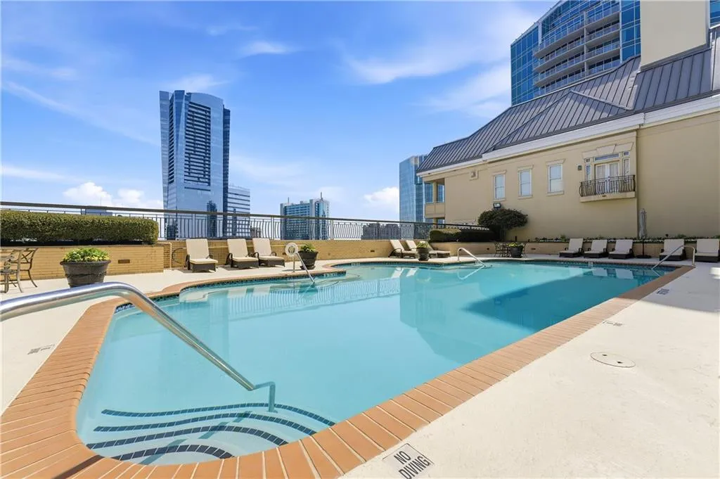 Community pool with a patio