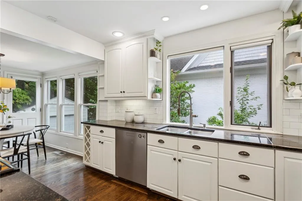 Kitchen featuring open shelves, dark wood-style floors, dishwasher, white cabinets, and recessed lighting