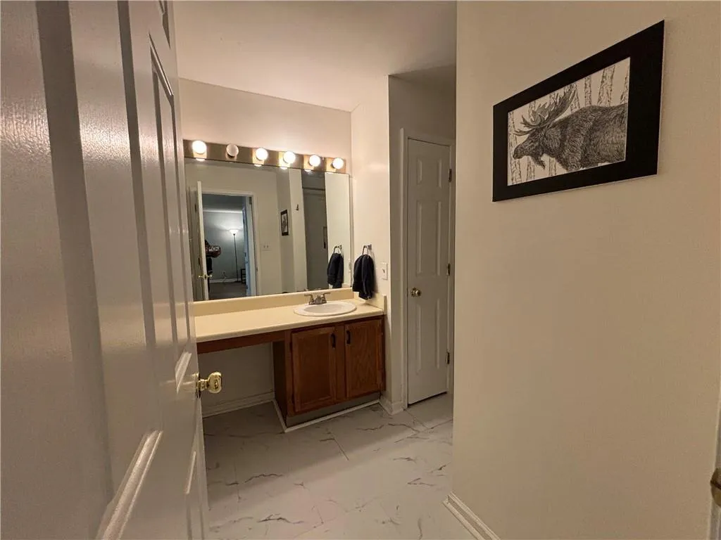 Bathroom with vanity and tile patterned floors