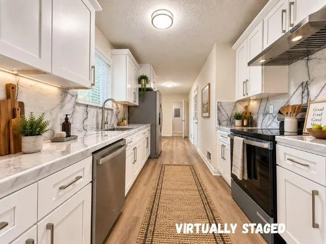 White shaker cabinetry with brushed nickel hardware