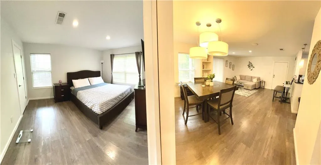 View of the bedroom and dining room from the bedroom entryway