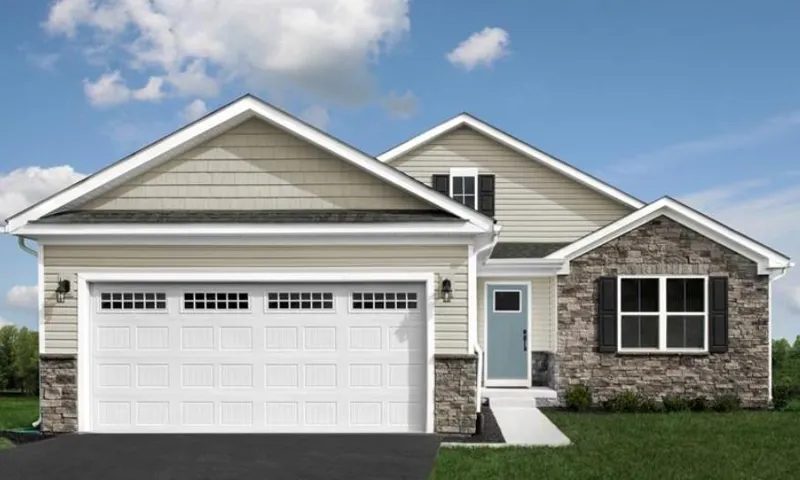 Exterior featuring a light blue entry door, stone veneer accents, white paneled garage door with window inserts, and dark window shutters