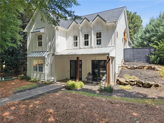 Modern farmhouse exterior with white board-and-batten siding