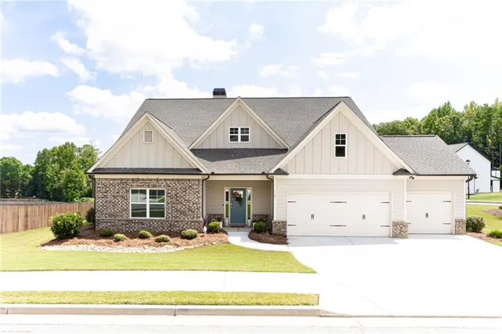 Crafted exterior featuring brick and board-and-batten siding