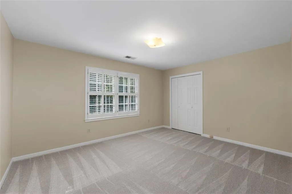 Another spacious guest room with new carpet