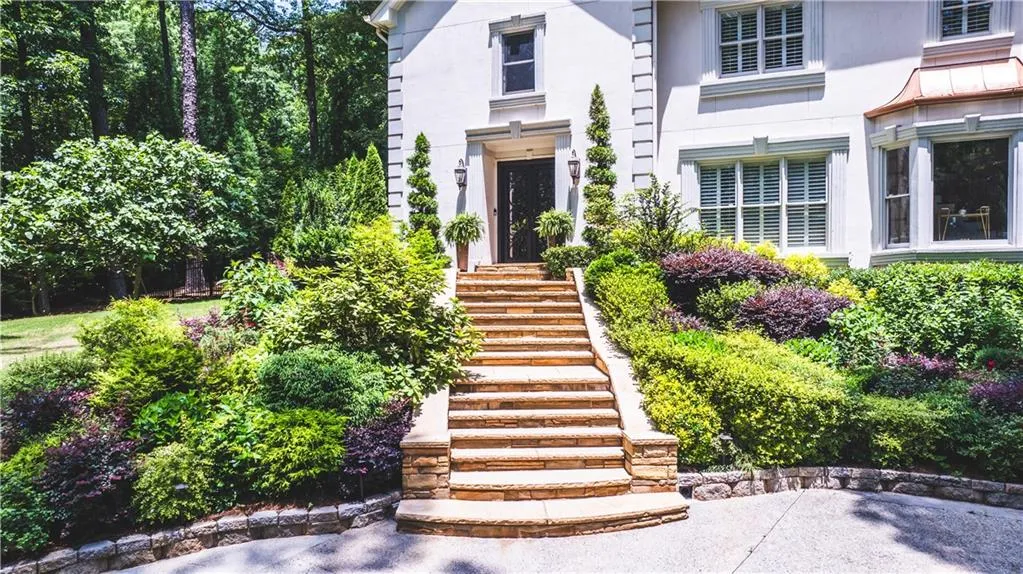 Property entrance featuring stucco siding
