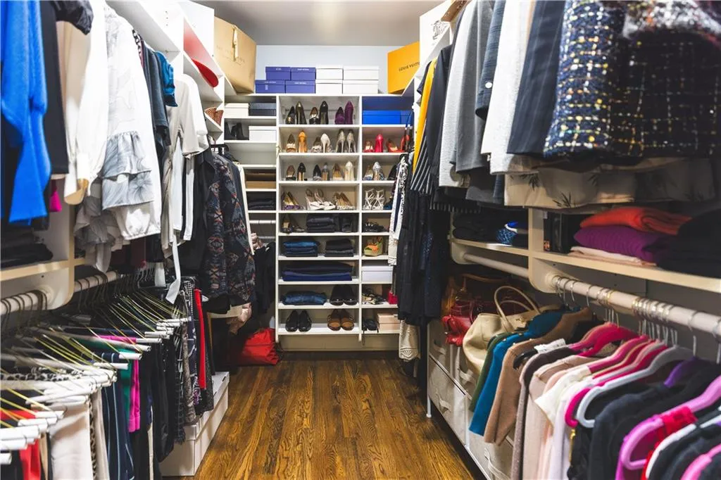 Walk in closet featuring wood finished floors