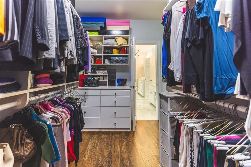 Spacious closet with wood finished floors