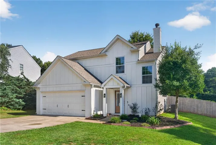 Adorable farmhouse style elevation with new board and batten. Updated inside and out!