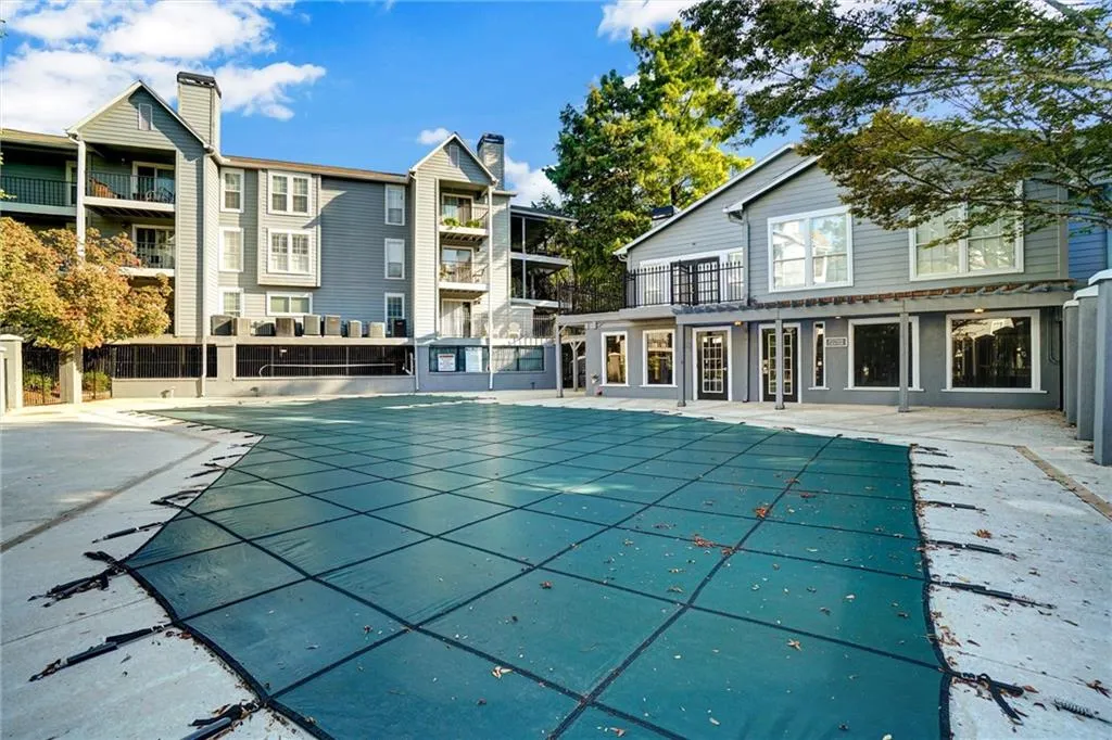 Community pool featuring a patio