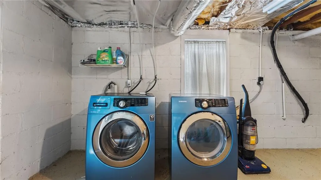 Laundry area featuring independent washer and dryer
