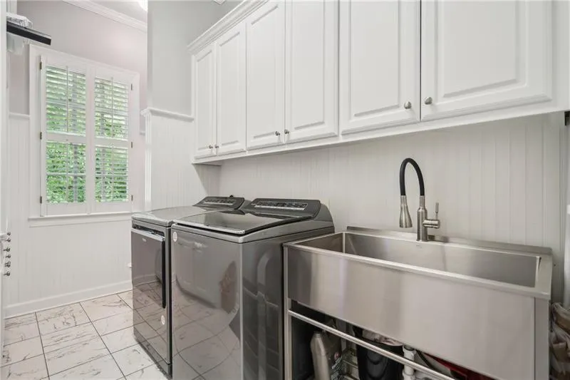 Laundry Room with Sink and Commode (toilet not pictured)