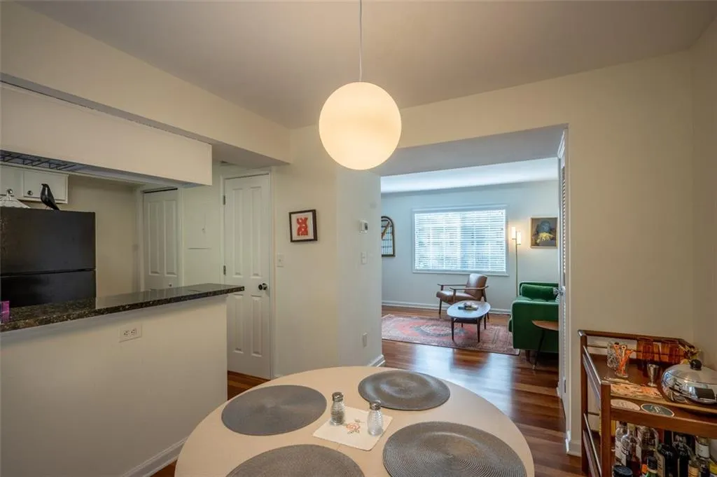 Dining room with dark wood-style floors