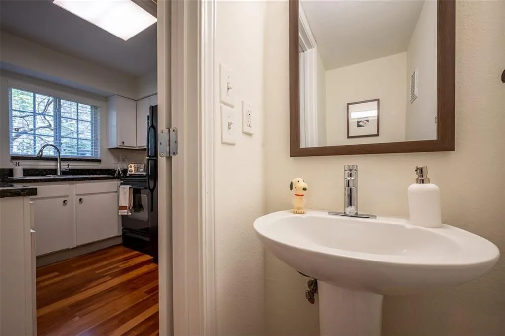 Bathroom featuring wood finished floors and a sink