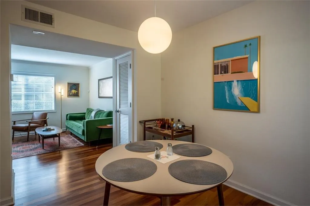 Dining room with wood finished floors and baseboards
