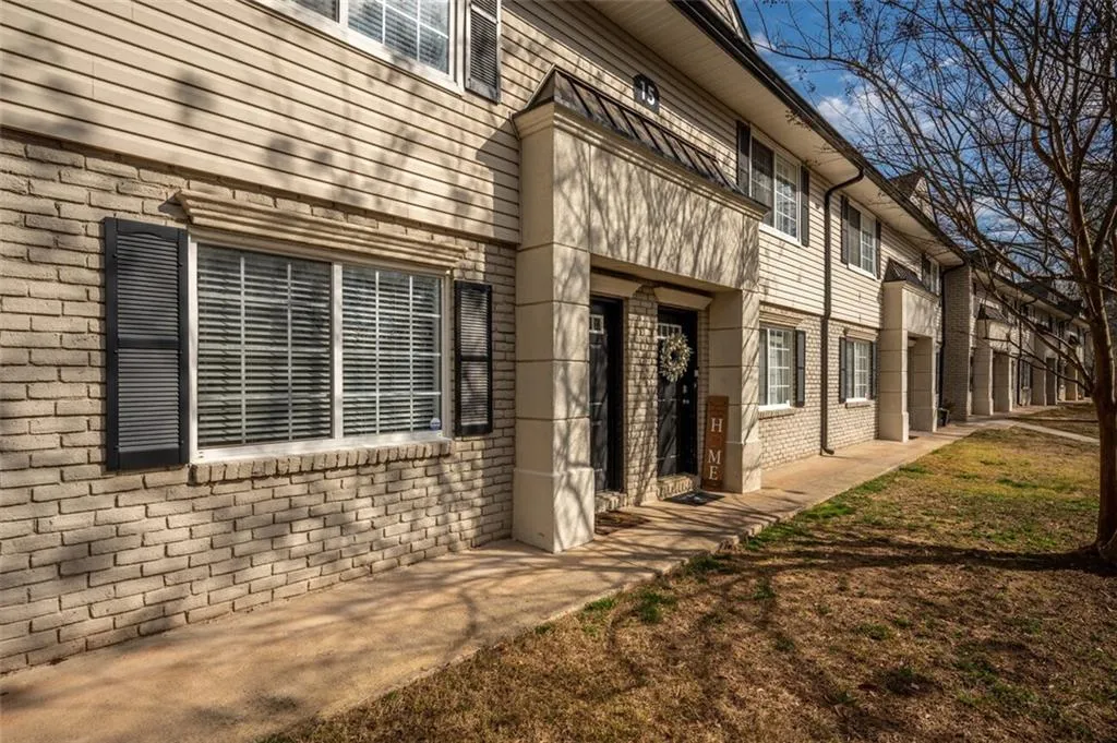 Property entrance with brick siding
