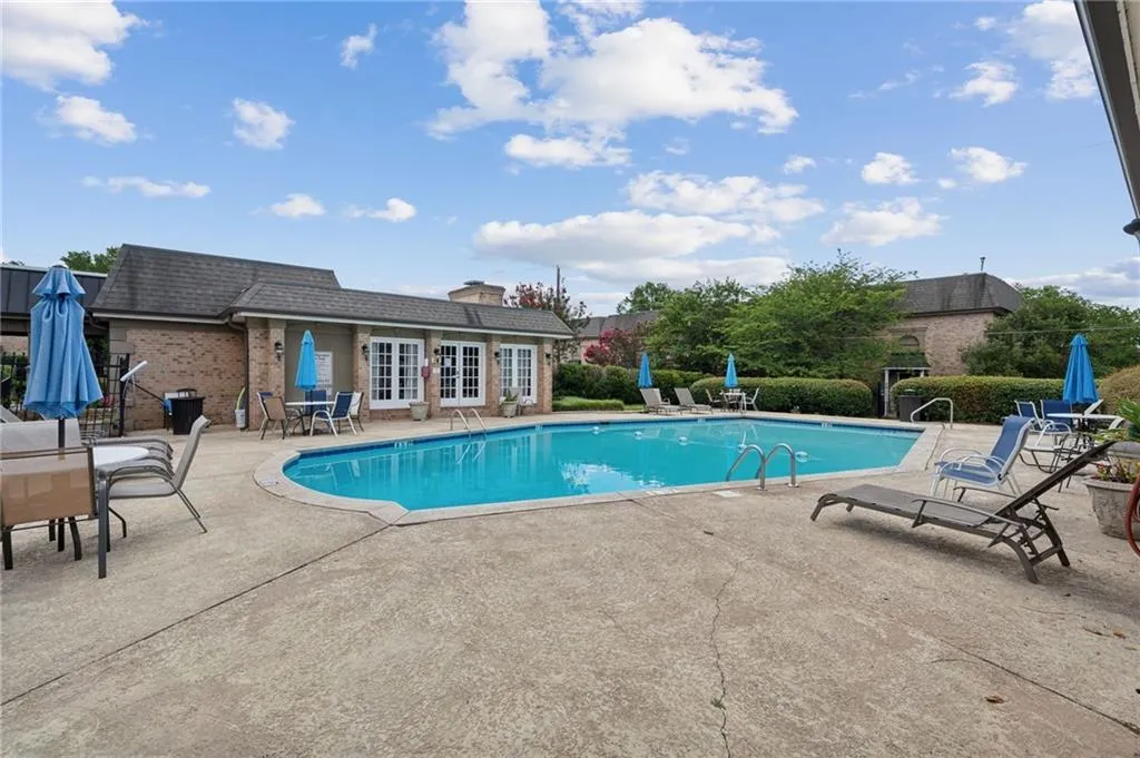View of swimming pool featuring a patio
