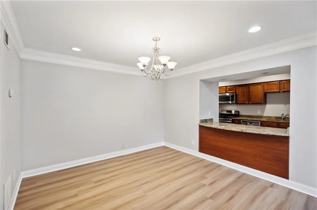Dining area with chandelier and breakfast bar