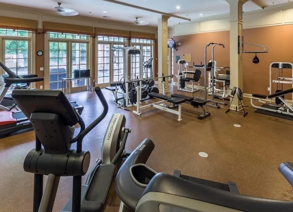 Gym with decorative columns and recessed lighting