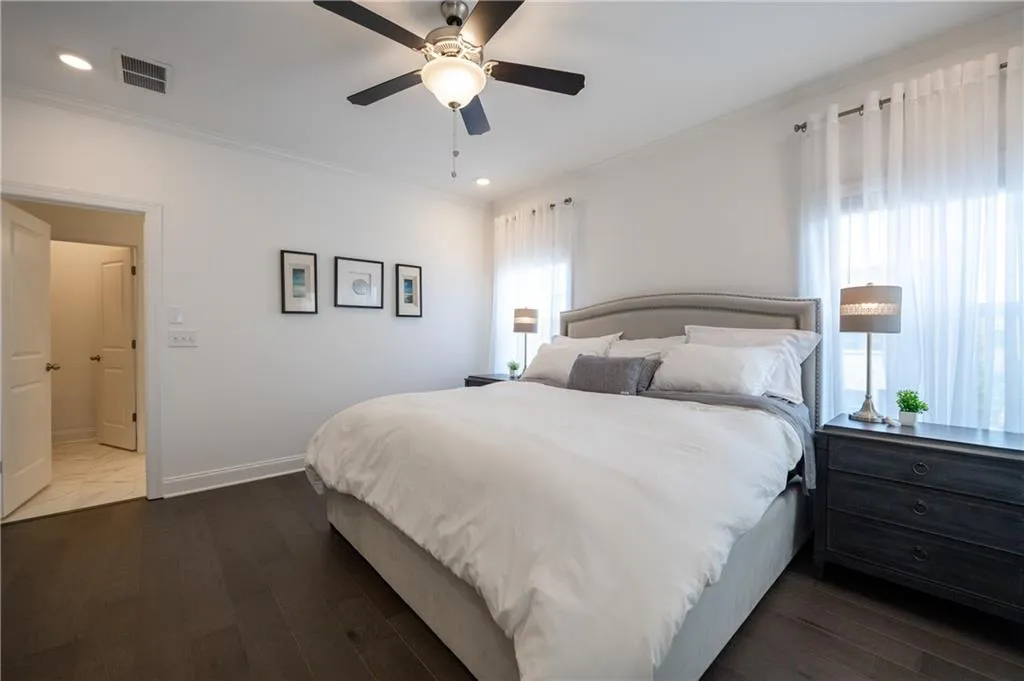Bedroom featuring dark wood-style floors, ceiling fan, ornamental molding, and recessed lighting