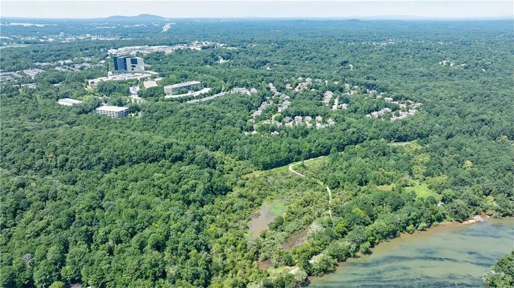 Aerial overview of property's location with a forest
