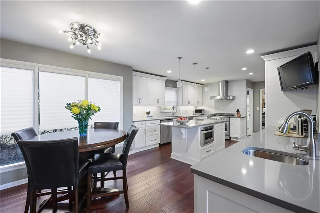 Kitchen view dinette - note the original period light fixture.