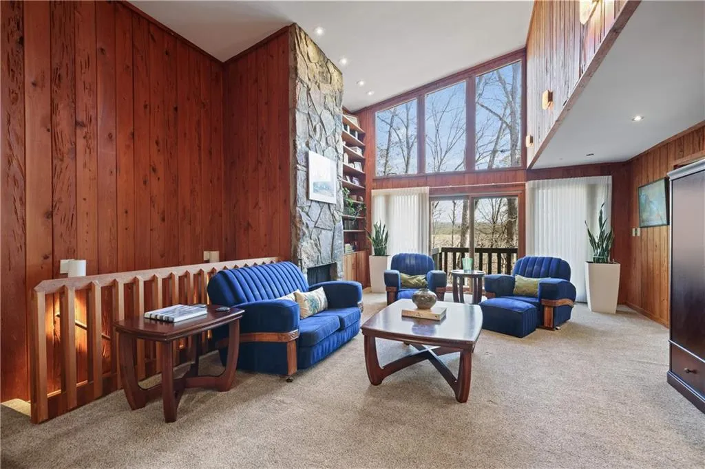 Vaulted Den w Wall of Windows!!! - view from kitchen