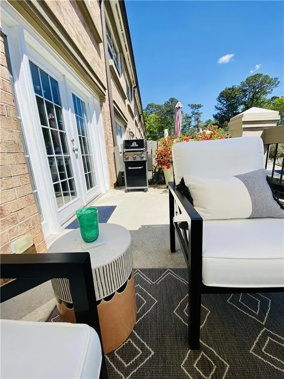 View of terrace with french doors and a grill
