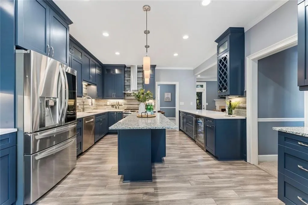• Custom cabinetry with extensive storage and soft-close features.