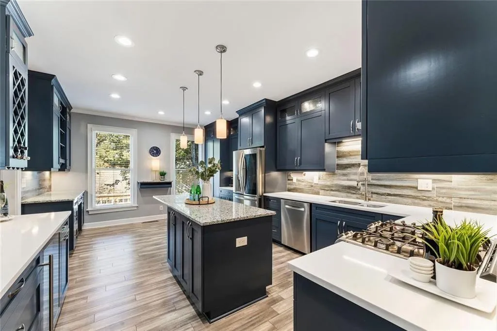 • Amazing gourmet design with designer recycled-glass and quartz island surfaces.