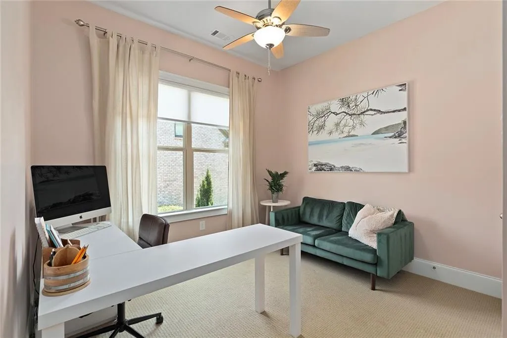 Office featuring light colored carpet and ceiling fan Office featuring light colored carpet and ceiling fan