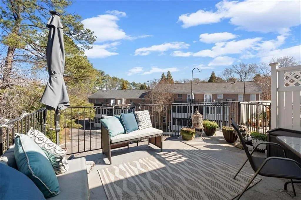 Wooden terrace with a patio area and an outdoor hangout area