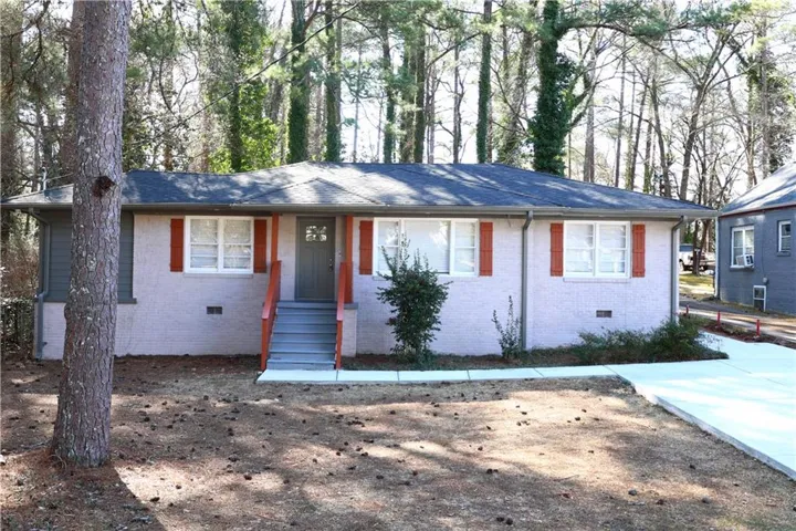 Ranch-style house featuring crawl space, brick siding, and a porch