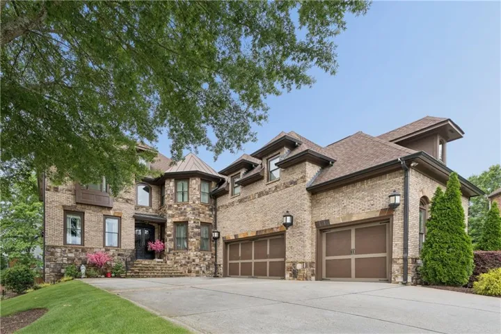 Brick and stone exterior featuring a turret detail