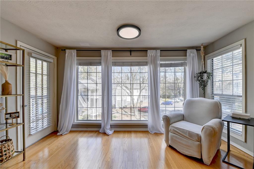 Great room with lots of windows and a view, letting lots of natural light in