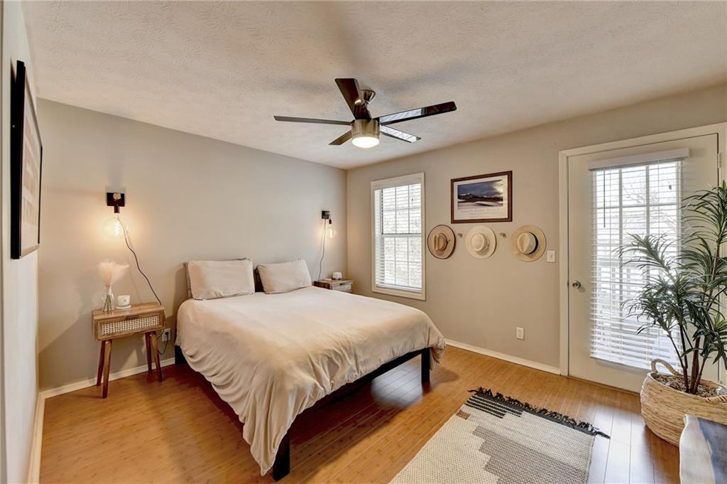 Master bedroom with french doors leading to balcony