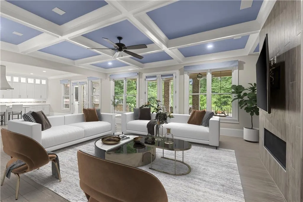 Living room with coffered ceiling, a large fireplace, beamed ceiling, and ceiling fan