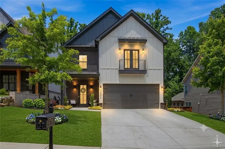 Modern two-story residence featuring a striking contemporary exterior with mixed materials including board-and-batten siding and stone accents