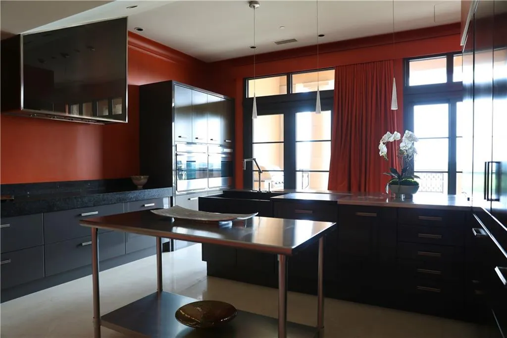 Kitchen with pendant lighting and stainless steel counters