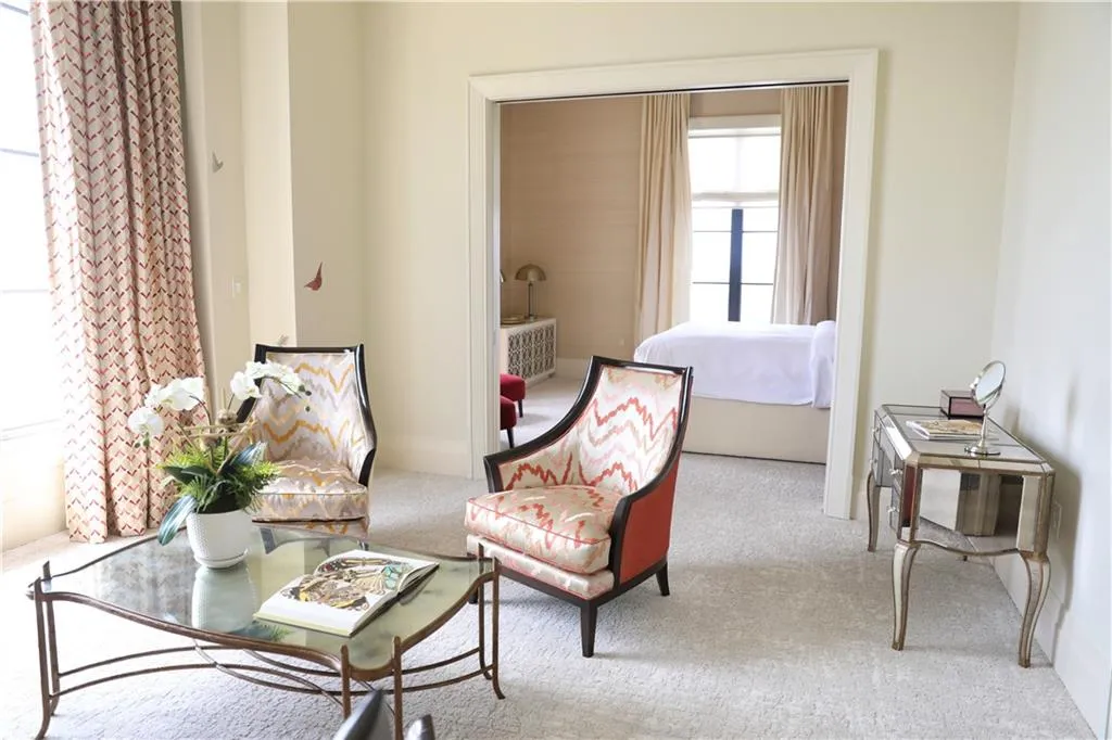 Living area with light colored carpet