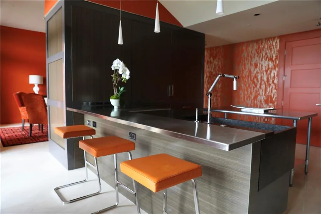 Bar with pendant lighting and stainless steel counters