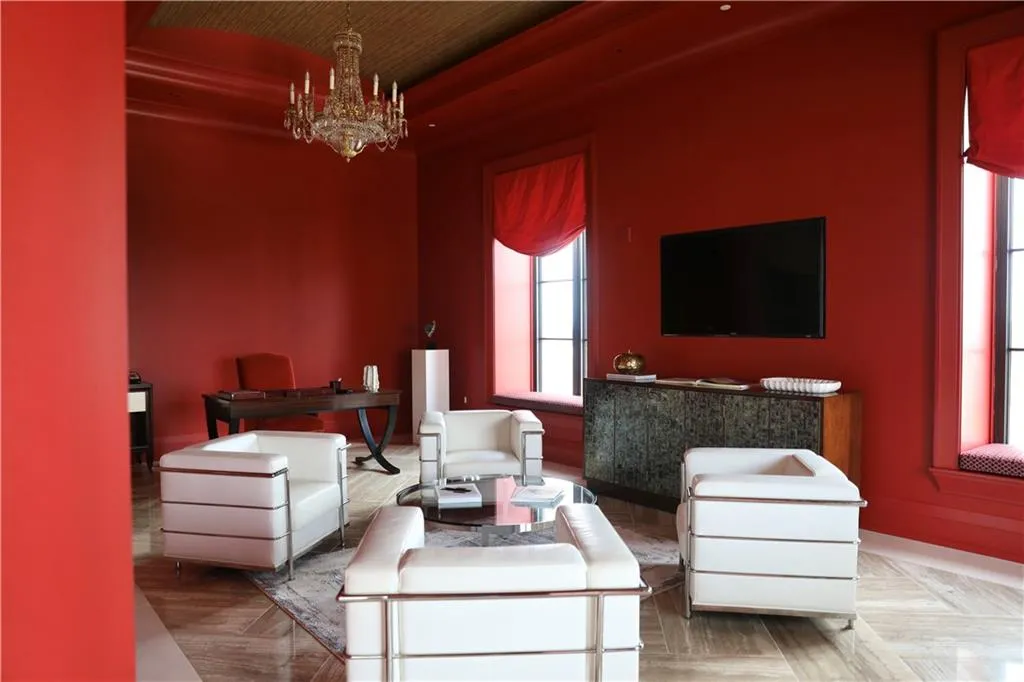 Living room featuring a notable chandelier and parquet floors