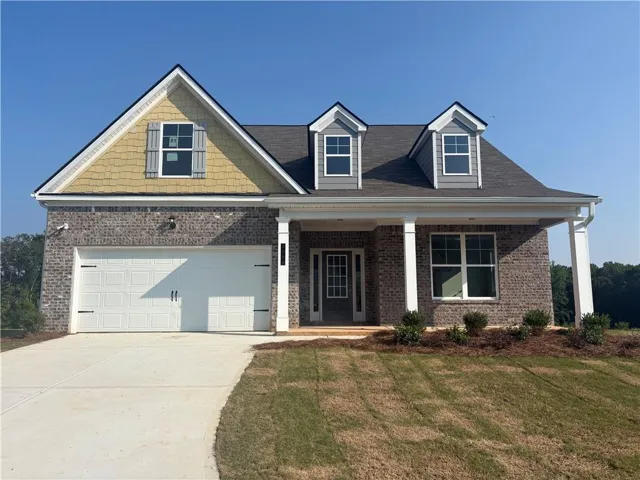 Brick and siding exterior with a two-car garage