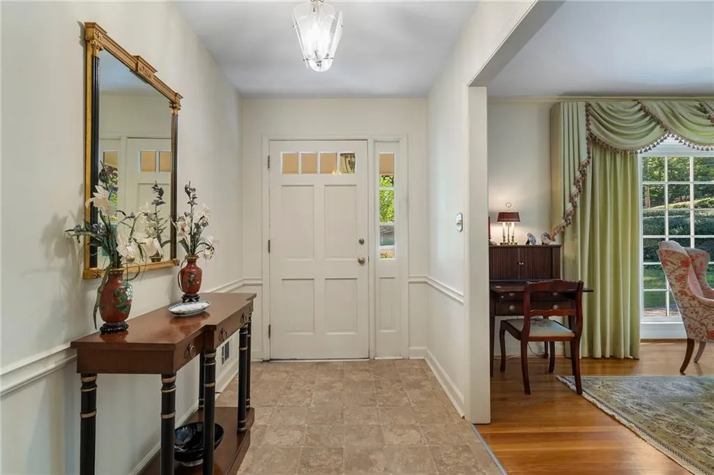 Entrance foyer featuring light hardwood / wood-style floors
