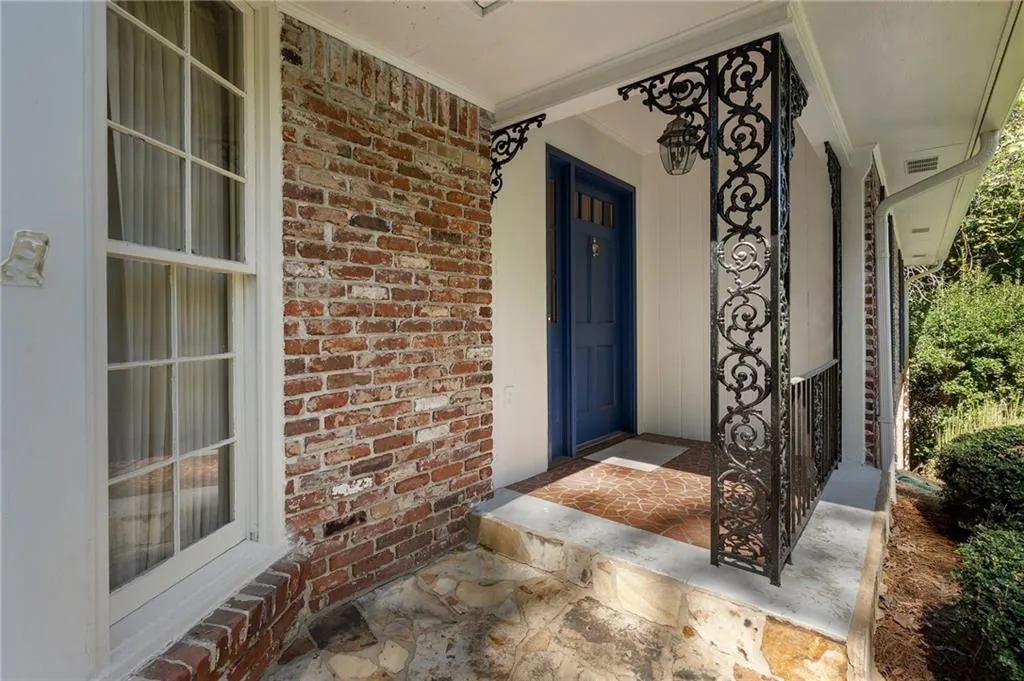 Doorway to property featuring a porch