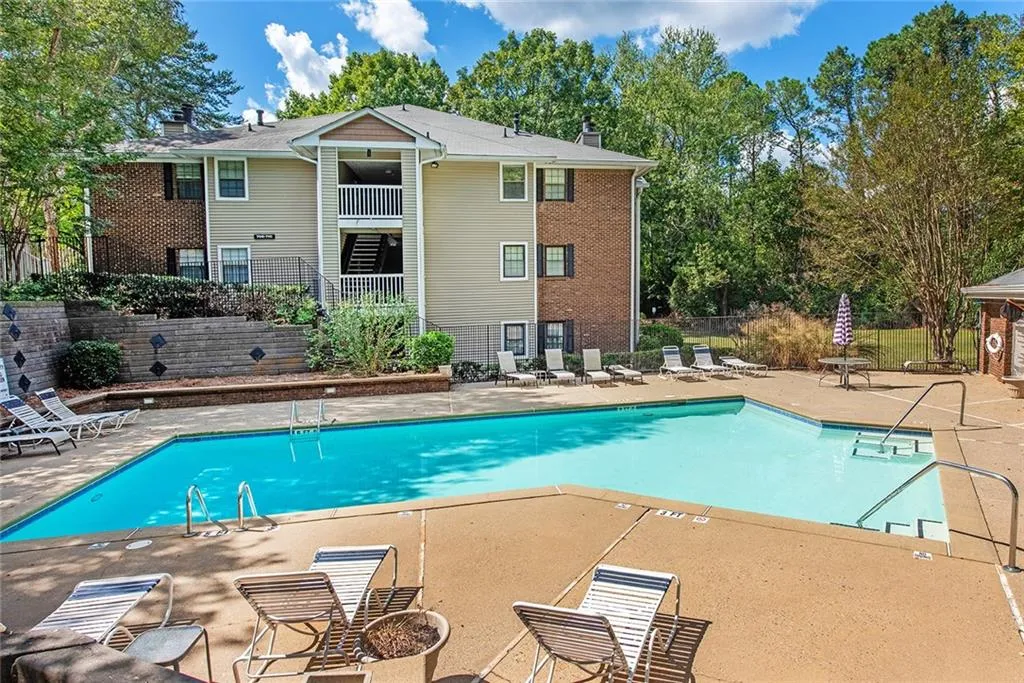 View of community pool with a patio