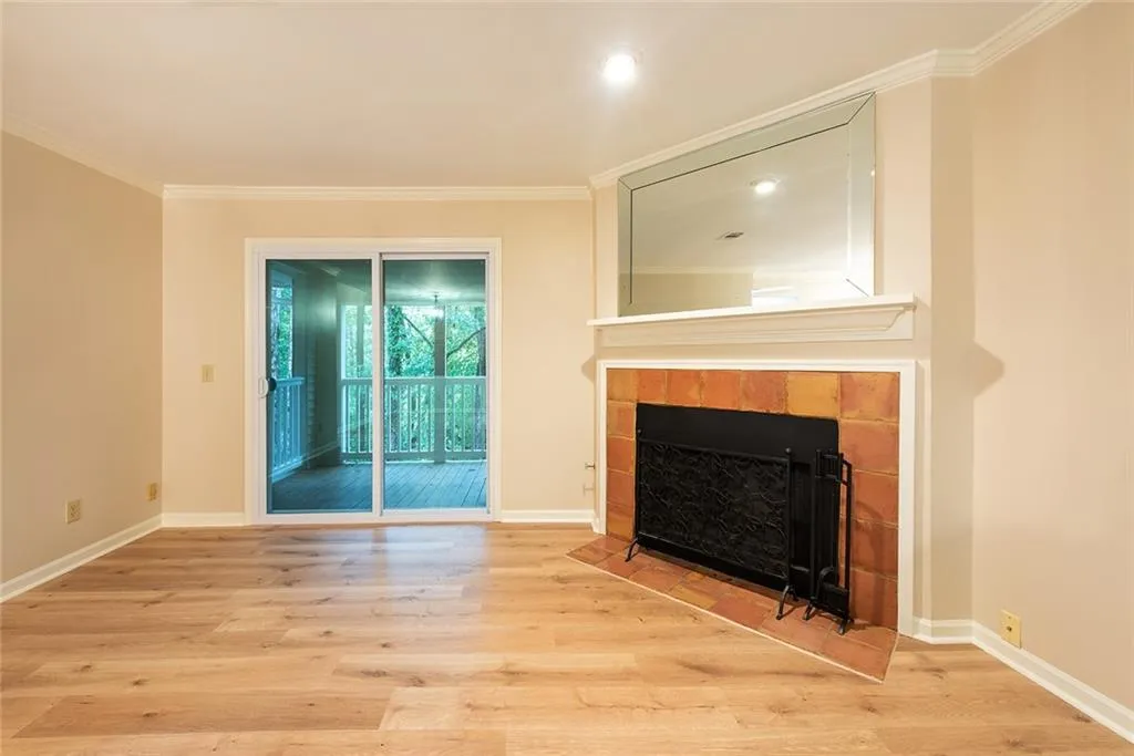 New sliding glass doors open to covered porch