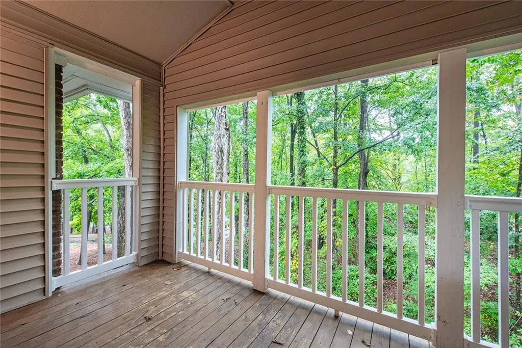 View of wooden deck off the living room.  Nature views!