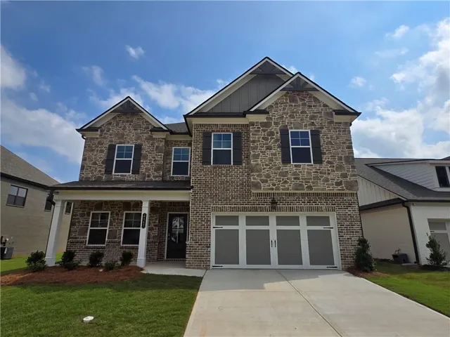 Stone and brick facade with gabled roof lines